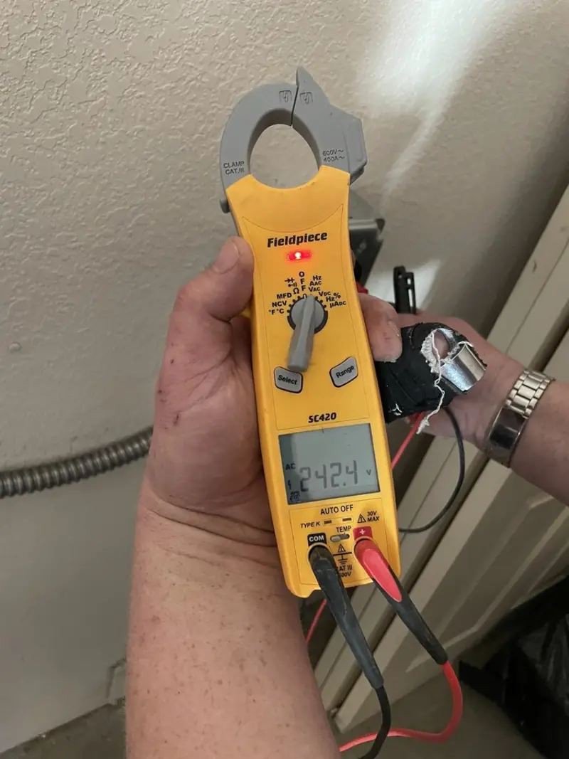 Voltage testing with clamp meter during Recessed Lighting Installation in Compton